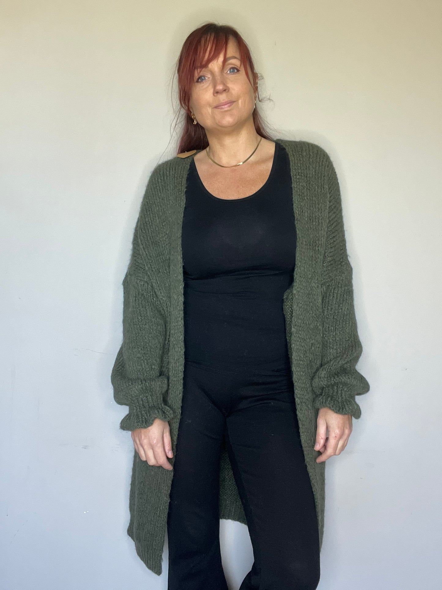 Lang vest met ruffle mouwen in groen, ecru en roze. One size tot maat 44.