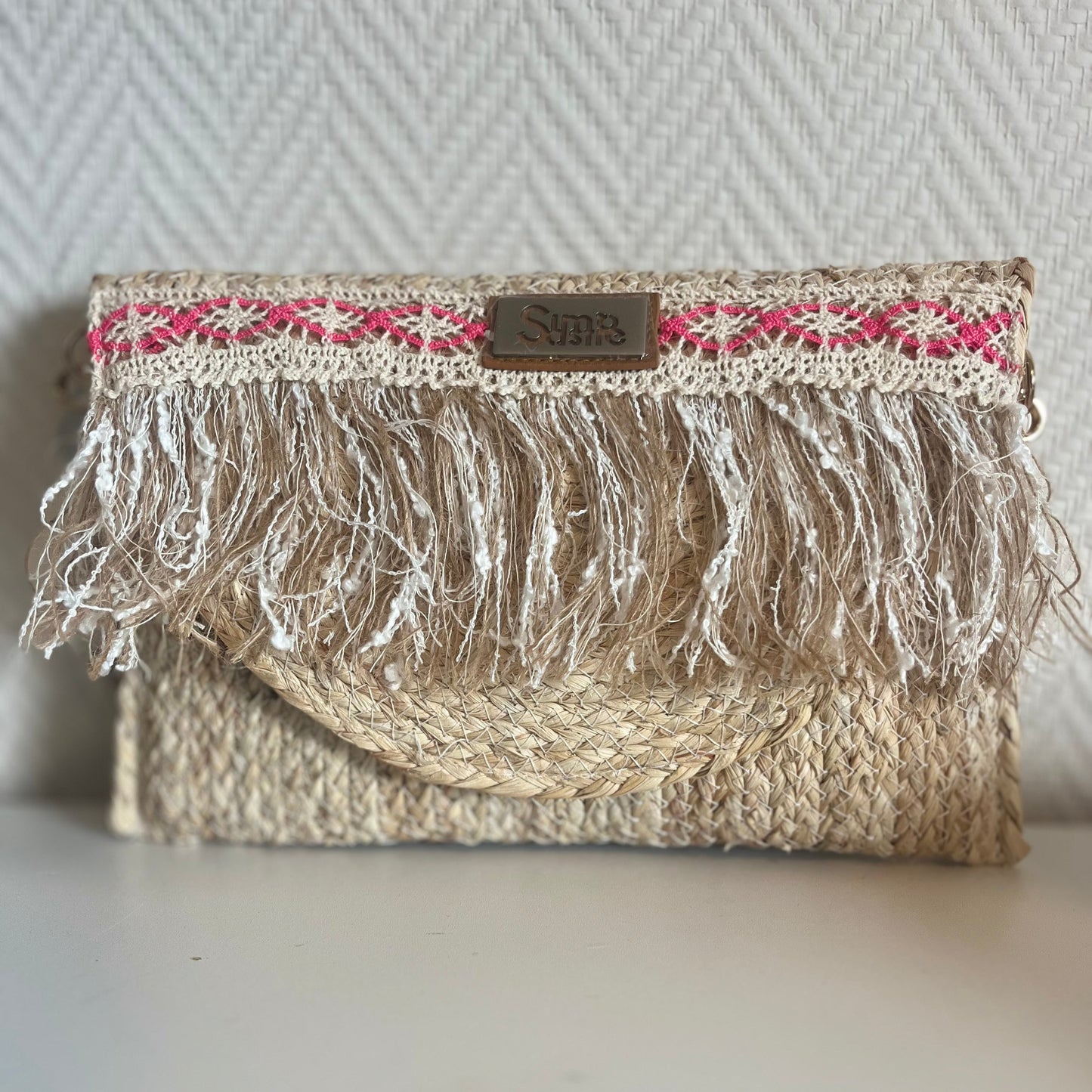 ibiza clutch met franjes in roze