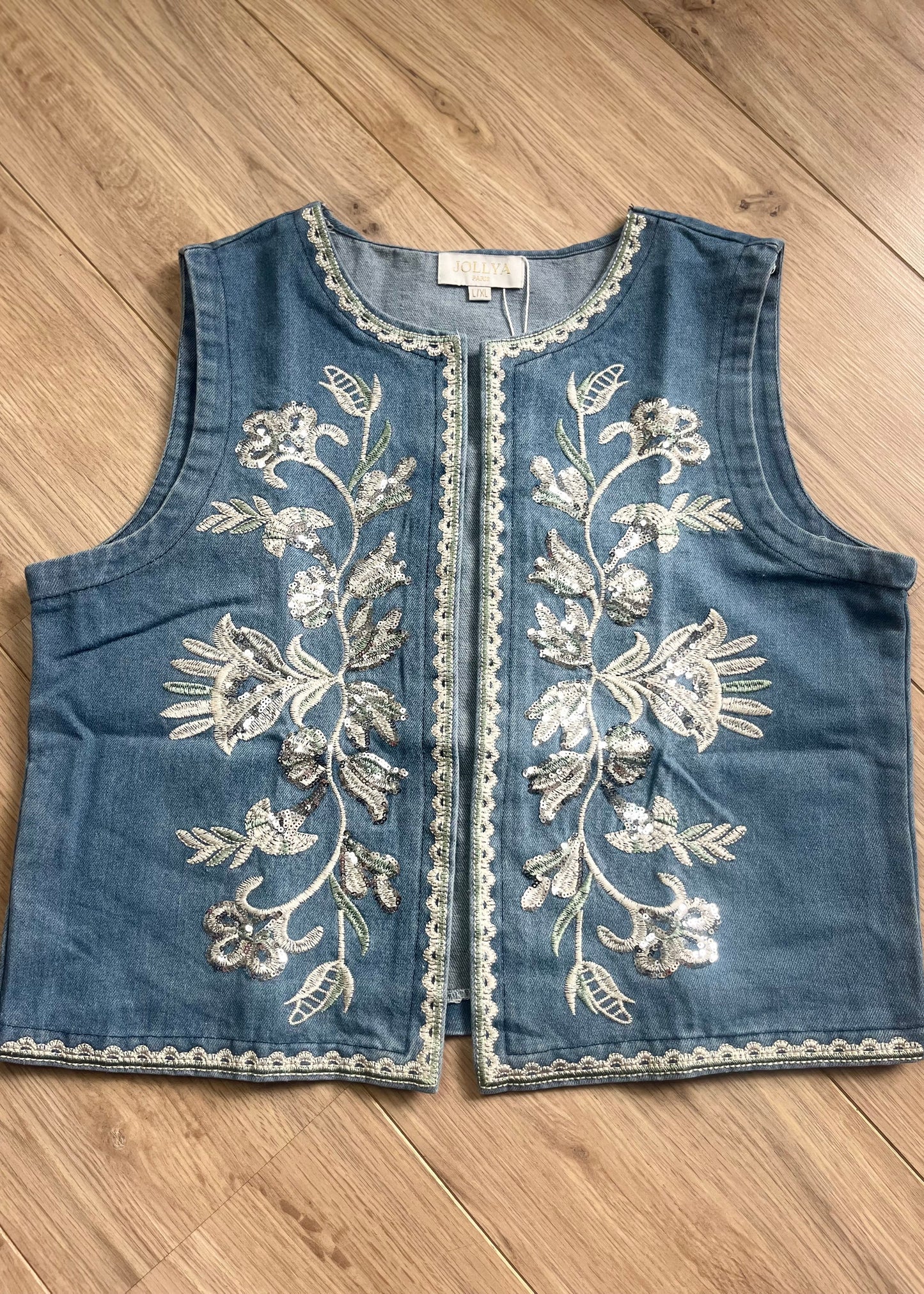 Denim damesgilet met glitterprint op de voorkant, stijlvolle mix van stoer en vrouwelijk in S/M en M/XL