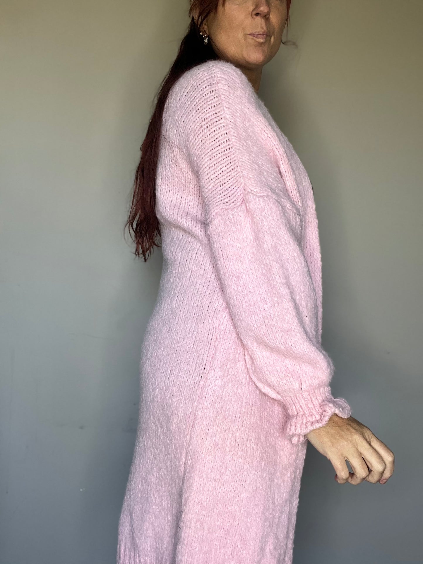 Lang vest met ruffle mouwen in groen, ecru en roze. One size tot maat 44.