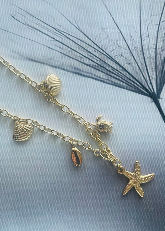 Stainless steel damesketting met beach bedels – schelpen, zeesterren, schildpadjes & meer. Verkleurt niet, waterproof, zomers & trendy.
