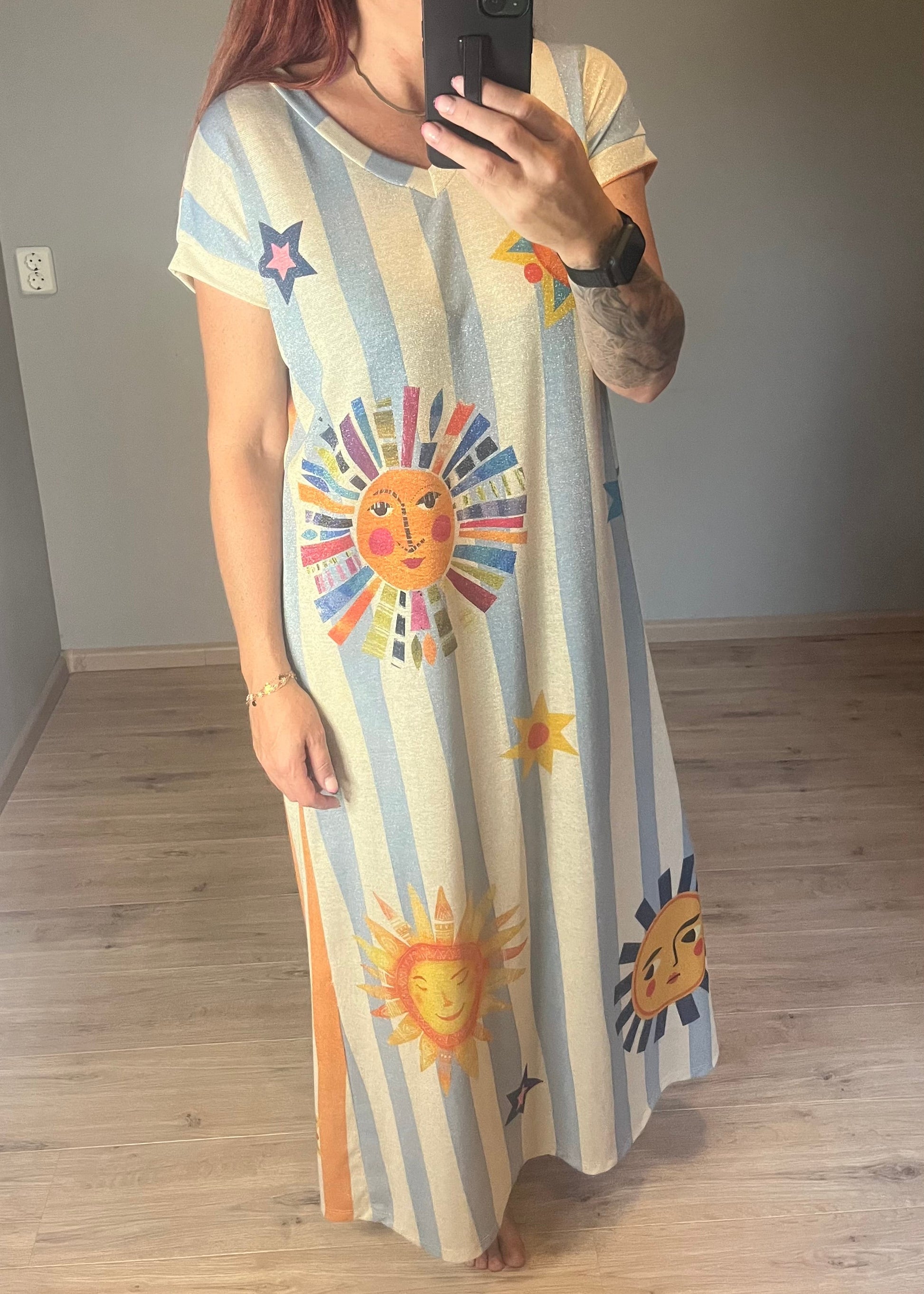 Schitterende lurex jurk met een zonnige print.