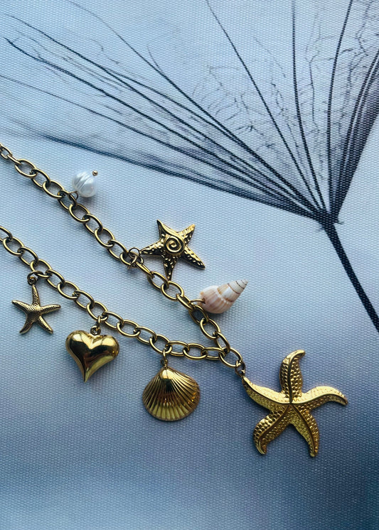 Stainless steel damesketting met beach bedels – schelpen, zeesterren, schildpadjes & meer. Verkleurt niet, waterproof, zomers & trendy.