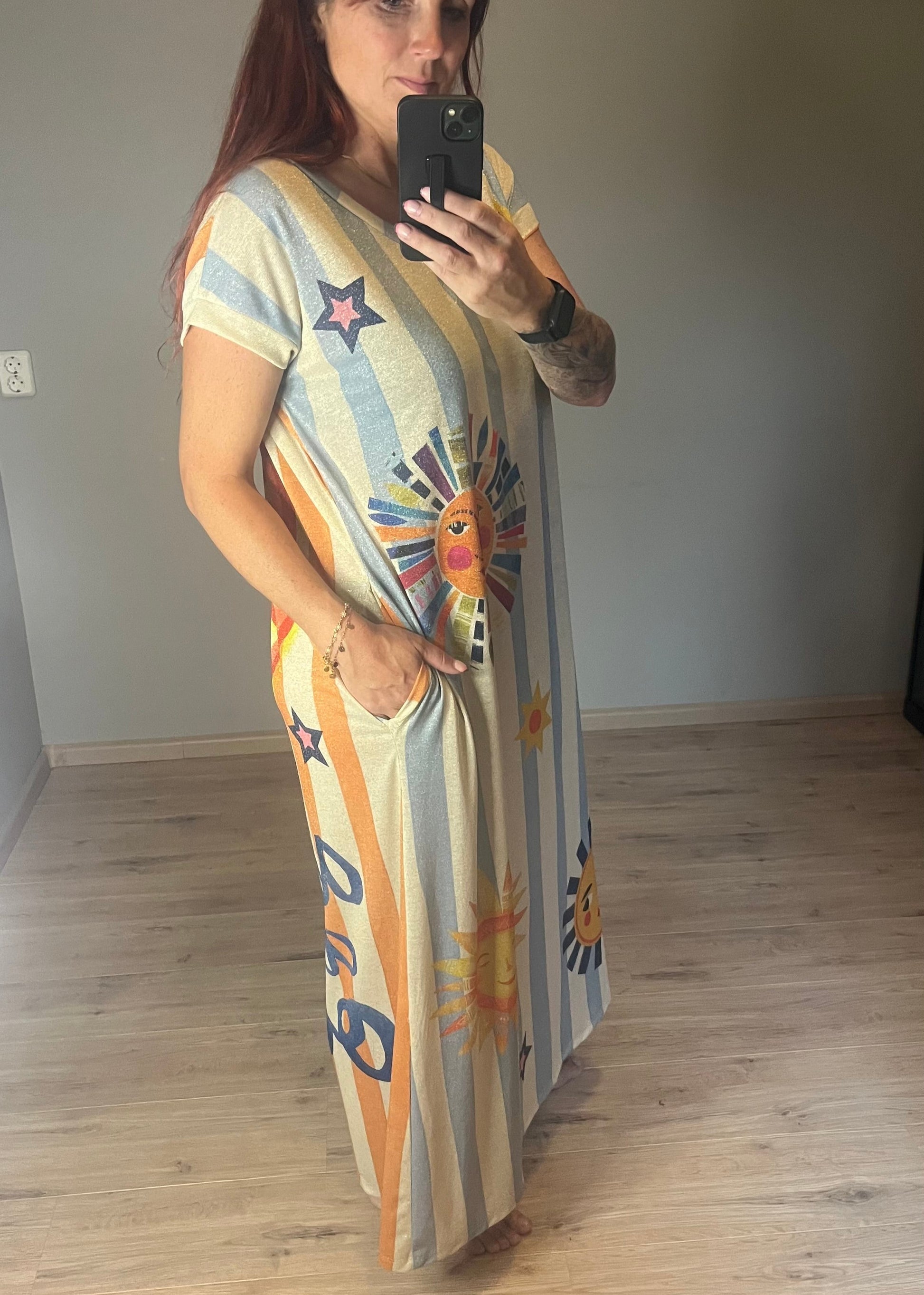 Schitterende lurex jurk met een zonnige print.